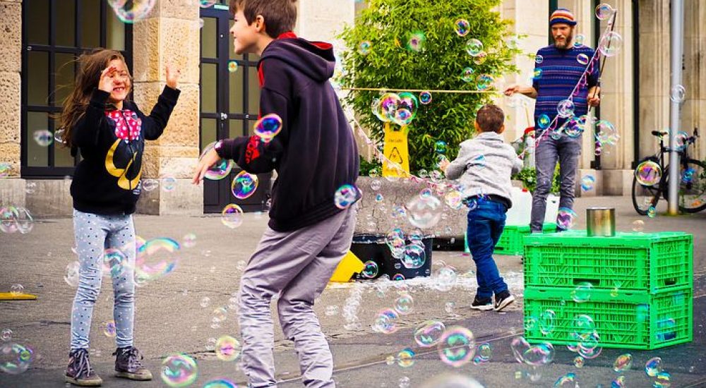 changing lives, kids playing, bubbles