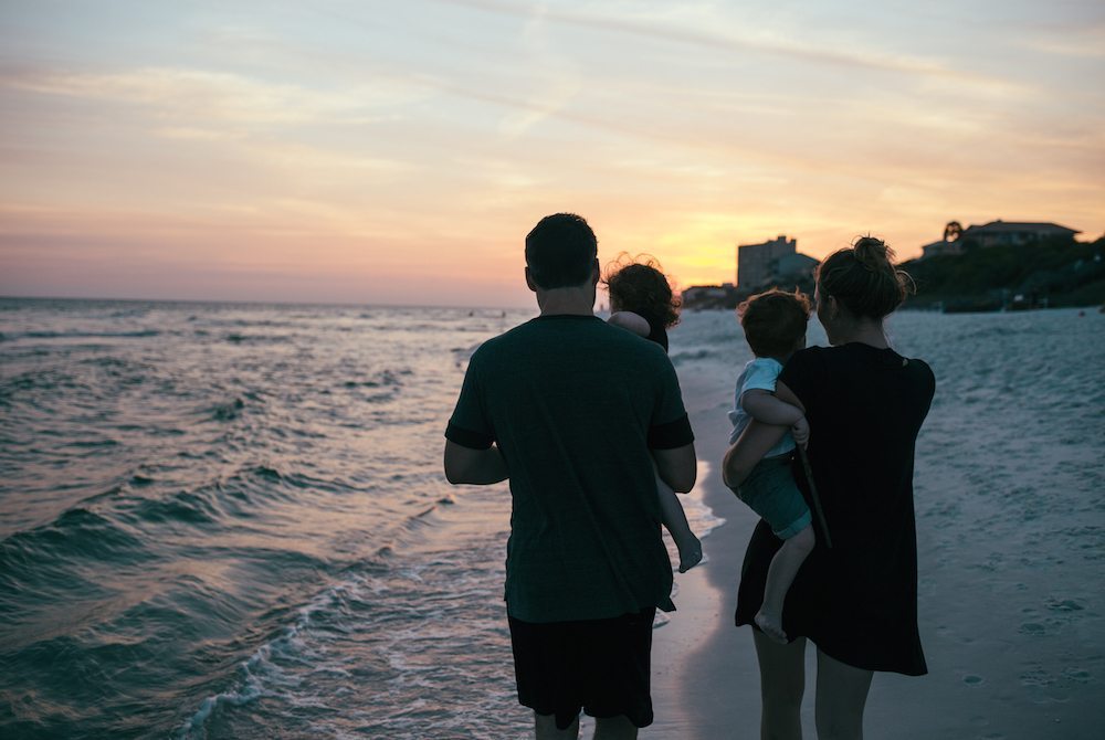 family walking beach