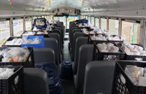 school bus staged for food distribution to families