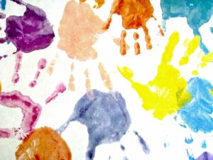 multicolored painted handprints