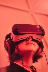 girl wearing virtual reality goggles