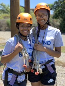 2 students in rock climbing gear