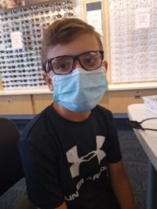 boy in glasses and mask