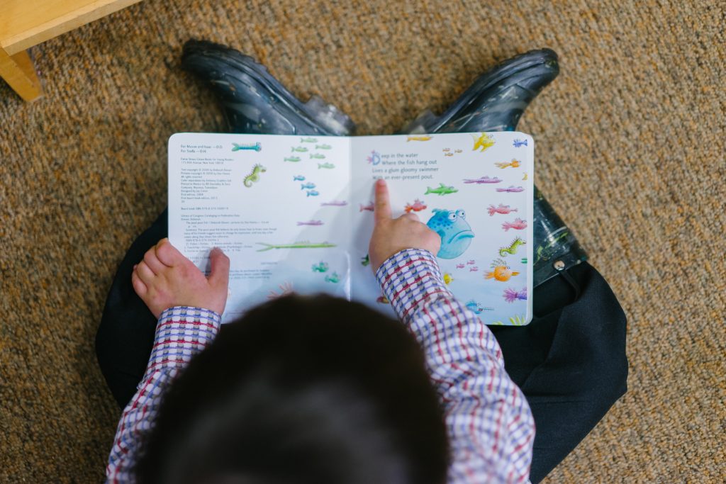 boy reading during story time