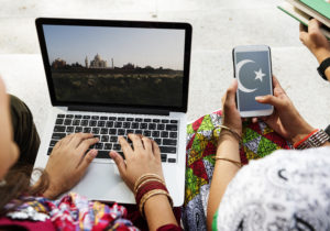 Muslim friends doing homework on a laptop