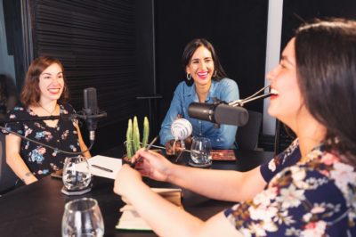 3 women recording a podcast