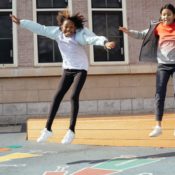 2 girls jumping on the playground - youth fitness can happen anywhere