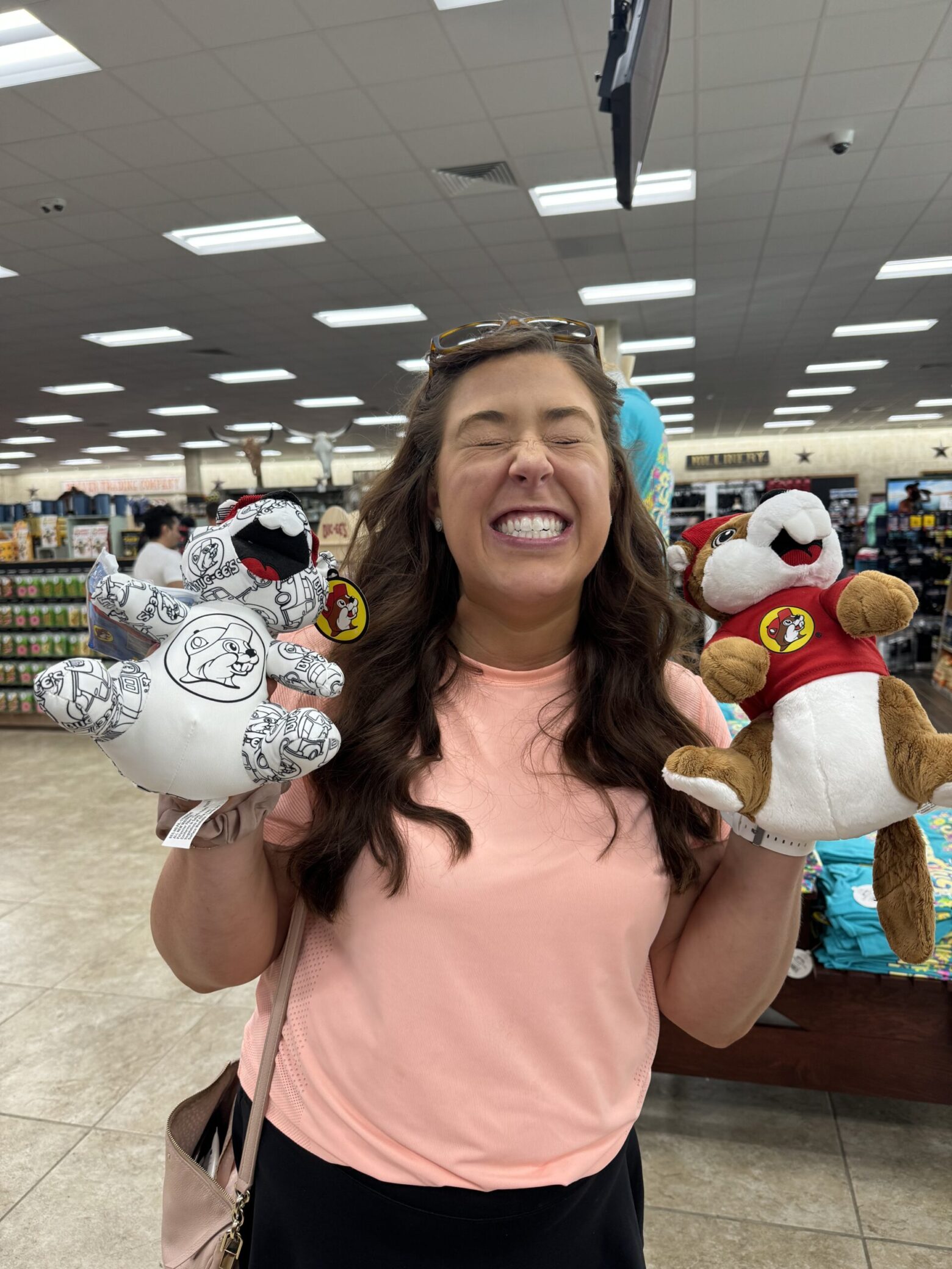 A photo Kaitlin and stuffed-animal toy beavers.