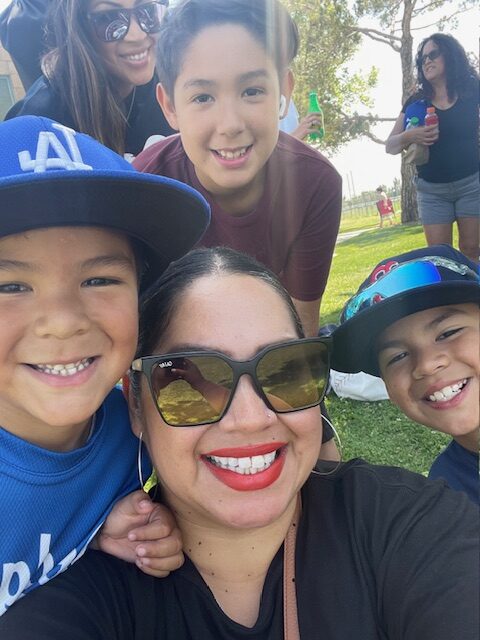 A photo of Melissa and three children.