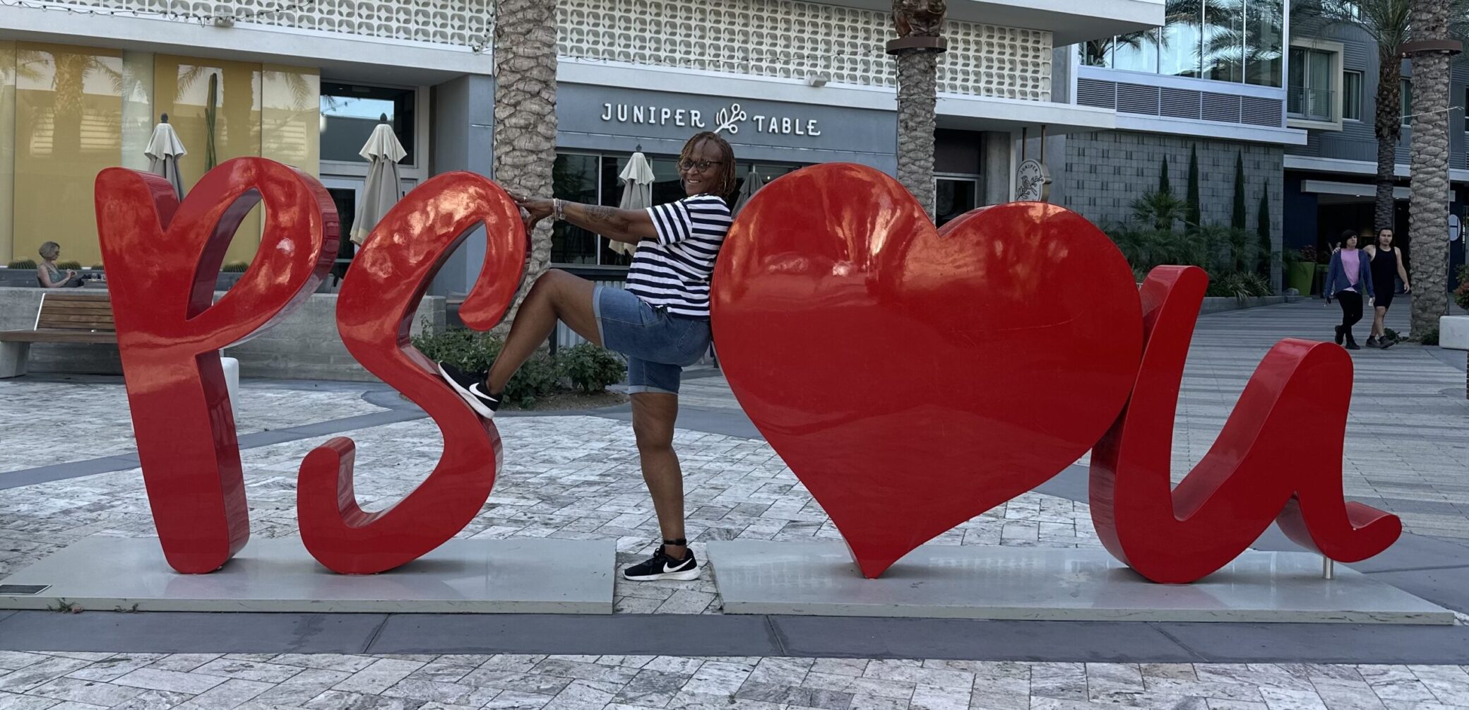 A photo of Sheila in Palm Springs with the PS I Love You sign.