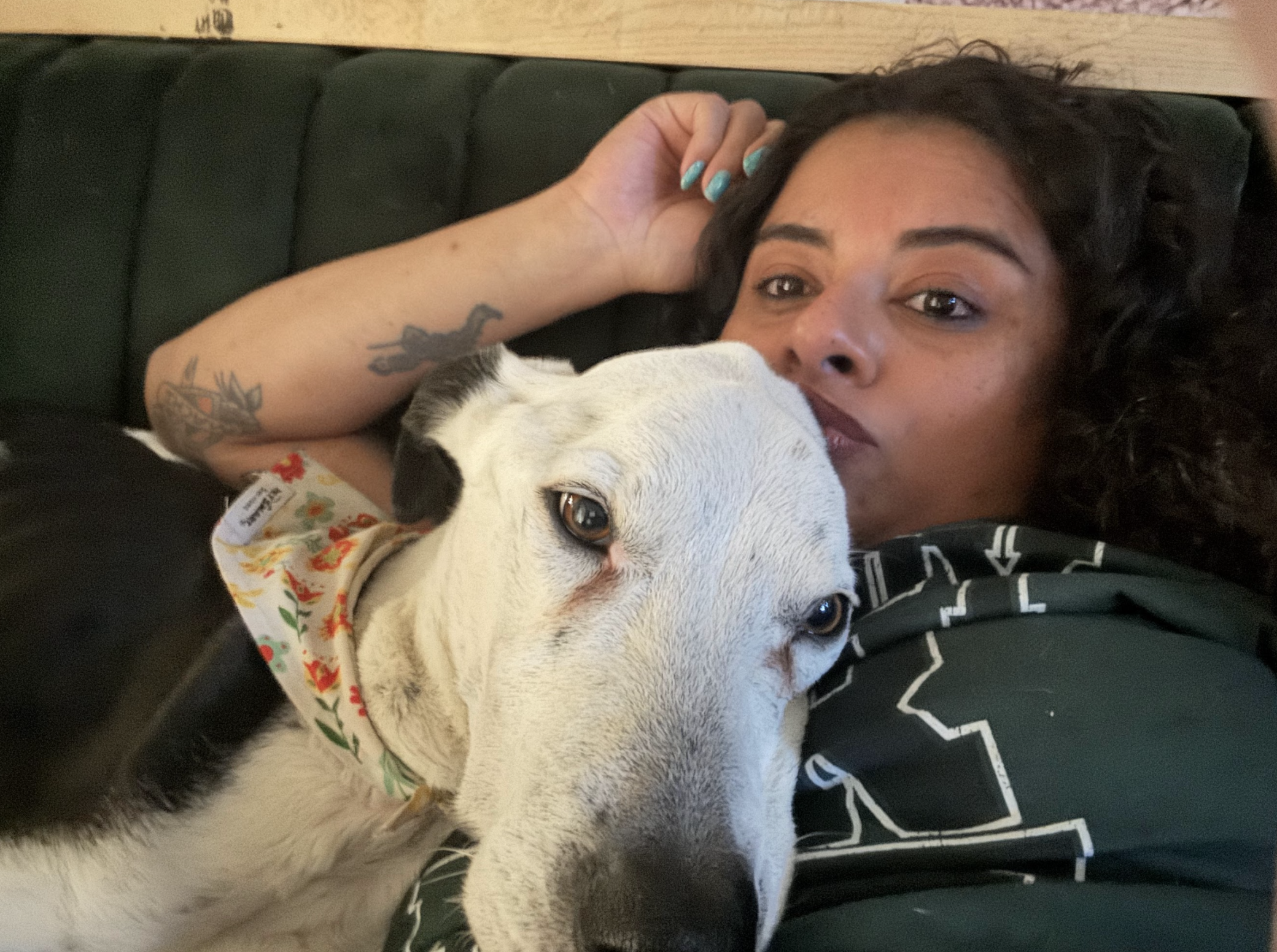 A photo of Susie and her dog, Bear, who has white fur.