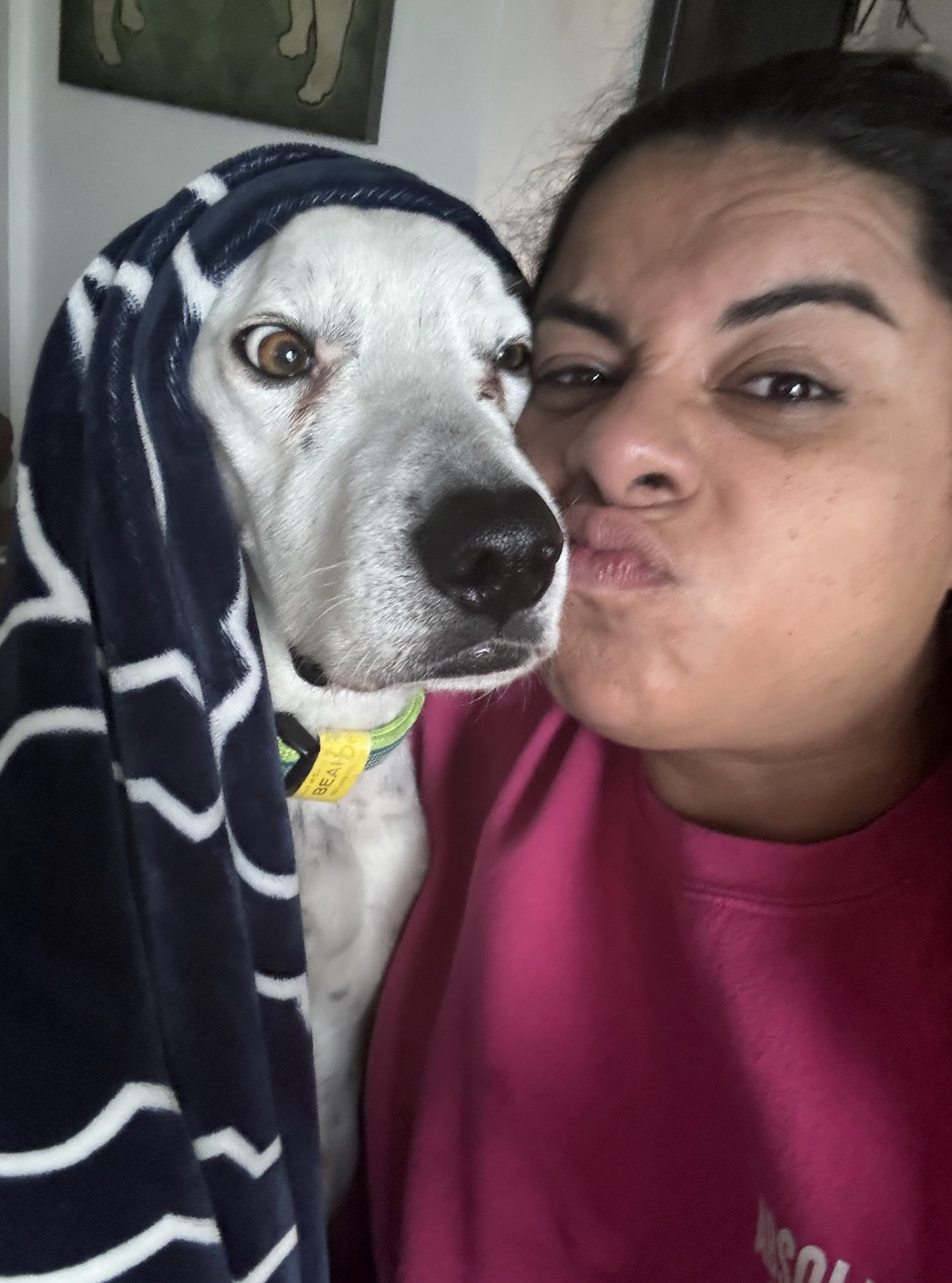 A photo of Susie and her white dog.