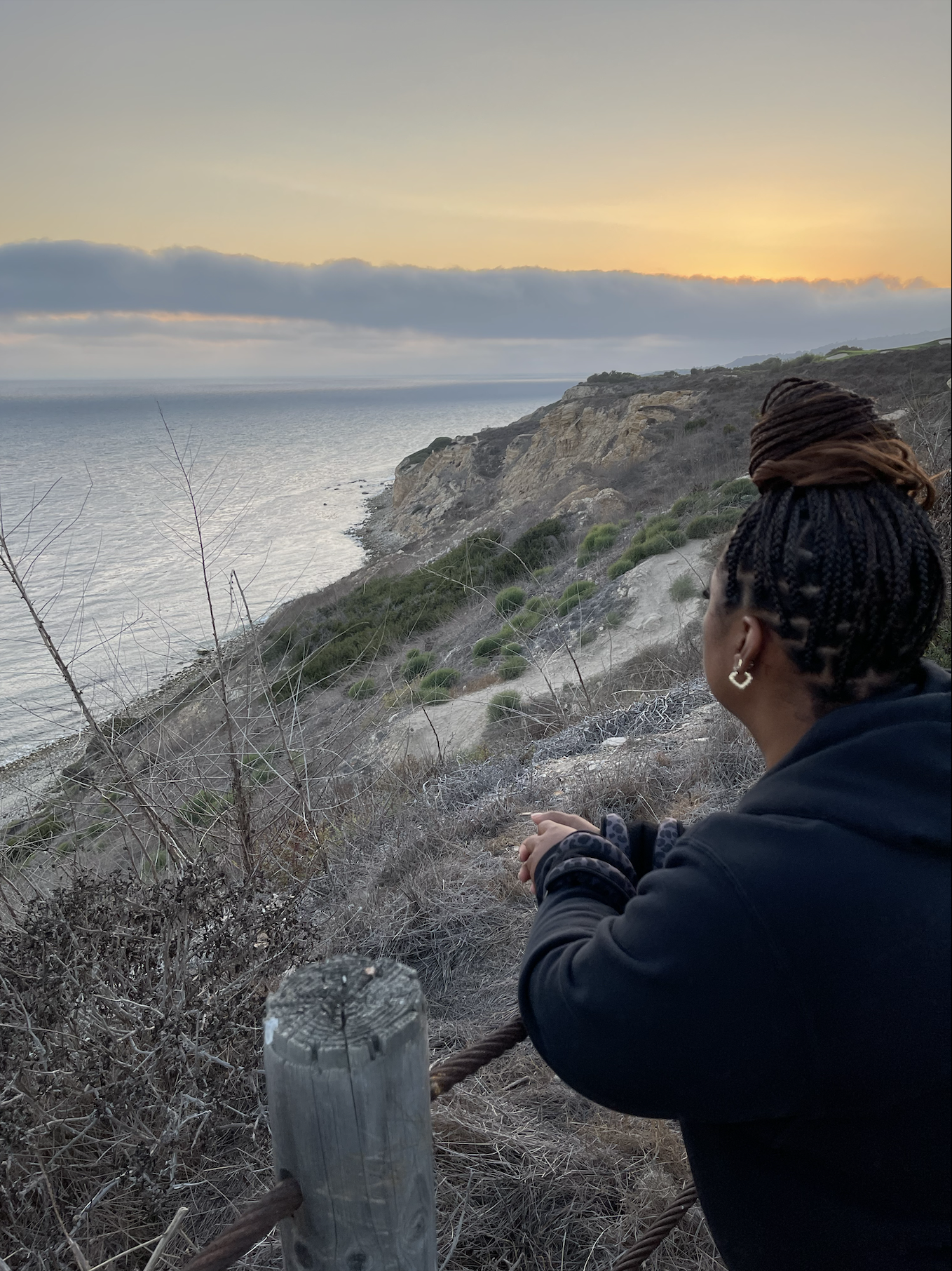 A photo of Alyson "AB" Bryant looking out at the ocean.